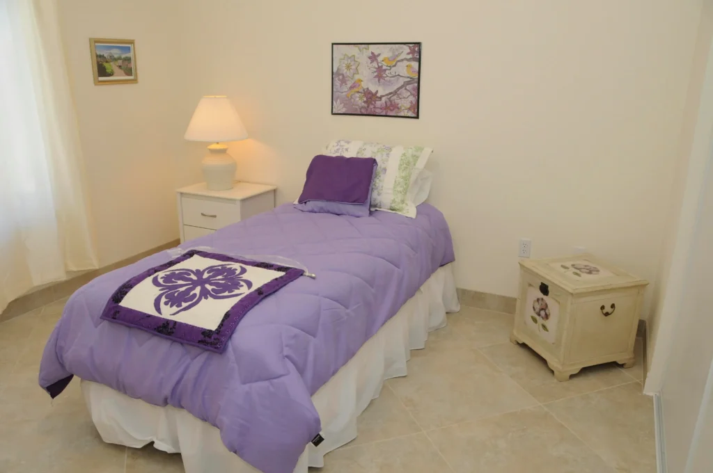 A purple comforter adorns a bed in a memory care center in Las Vegas.